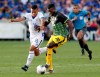 El Salvador midfielder Oscar Ceren (16) attempts to steal the ball from Jamaica defender Kemar Lawrence (20) during the second half of a CONCACAF Gold Cup soccer match in Houston, Friday, June 21, 2019. Toronto FC added some experience to its backline Friday, acquiring Jamaican international defender Kemar Lawrence from Belgium's Anderlecht. THE CANADIAN PRESS/AP-Michael Wyke