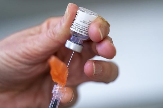 A syringe is loaded with COVID-19 vaccine at a vaccination clinic run by Vancouver Coastal Health, in Richmond, B.C., Saturday, April 10, 2021. Ontario is expected to lower the age of COVID-19 vaccine eligibility to 40 across the province this week as it continues to expand its rollout. THE CANADIAN PRESS/Jonathan Hayward
