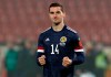 FILE - In this Thursday, Nov. 12, 2020 file photo, Scotland's Kenny McLean celebrates after scoring from a penalty during the Euro 2020 playoff final soccer match between Serbia and Scotland, at the Rajko Mitic stadium in Belgrade, Serbia. Norwich midfielder Kenny McLean whose decisive penalties in two playoff shootouts helped Scotland to its first European Championship in 25 years, was on Tuesday May 11, 2021 ruled out of the tournament through injury. (AP Photo/Darko Vojinovic, File)