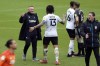 Derby County manager Wayne Rooney, left, celebrates with Colin Kazim-Richards (13) after a Sky Bet Championship soccer match at Pride Park, Saturday, May 8, 2021, in Derby, England. Rooney has kept a relegation off his resumé after his team came back to earn a vital point against Sheffield Wednesday in a season-ending 3-3 draw to stay in the English second division next season. (Nigel French/PA via AP)