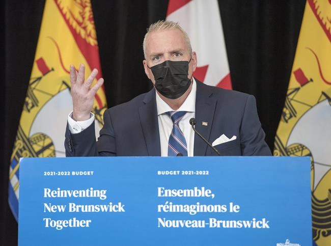 New Brunswick Finance Minister Ernie Steeves speaks at a news conference in the Legislature in Fredericton, N.B., on Tuesday, March 16, 2021. THE CANADIAN PRESS/Stephen MacGillivray