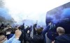 Manchester City supporters greet the team coach as they gather outside the Etihad stadium in Manchester, England, Saturday, May 8, 2021 where the England Premier League match between Manchester City and Chelsea is to be played. City fans are hoping that a win on Saturday will see their team clinch the English Premier League title. (AP Photo/Jon Super)