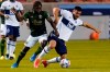 Portland Timbers forward Yimmi Chara (23) and Vancouver Whitecaps forward Lucas Cavallini, right, battle for the ball in the first half during an MLS soccer game, Sunday, April 18, 2021, in Sandy, Utah. THE CANADIAN PRESS/AP-Rick Bowmer