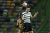 Sporting's Sebastian Coates jumps for the ball with Boavista's Elis, left, during the Portuguese League soccer match between Sporting CP and Boavista FC at the Alvalade stadium in Lisbon, Tuesday, May 11, 2021. (AP Photo/Pedro Rocha)