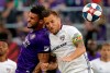 Former Orlando City forward Dom Dwyer, left, and FC Dallas defender Reto Ziegler, right, collide while going up for a header during the first half of an MLS soccer match, Saturday, Aug. 3, 2019, in Orlando, Fla. Toronto FC added experience up front Tuesday, signing Dwyer through 2022. THE CANADIAN PRESS/AP, John Raoux