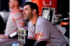 Baltimore Orioles starting pitcher Matt Harvey sits in the dugout during the first inning of a baseball game against the New York Mets, Wednesday, May 12, 2021, in New York. (AP Photo/Kathy Willens)
