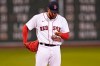Boston Red Sox starting pitcher Eduardo Rodriguez looks down at a fresh baseball after giving up a solo home run to Oakland Athletics' Matt Olson during the sixth inning of a baseball game, Wednesday, May 12, 2021, in Boston. (AP Photo/Charles Krupa)