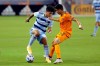 Sporting Kansas City defender Jaylin Lindsey, left, tries to work the ball around Houston Dynamo midfielder Joe Corona (14) during the first half of an MLS soccer match Wednesday, May 12, 2021, in Houston. (AP Photo/Michael Wyke)