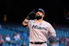 Miami Marlins' Sandy Leon points to the sky as he arrives at home plate after hitting a home run against the Arizona Diamondbacks during the second inning of a baseball game Wednesday, May 12, 2021, in Phoenix. (AP Photo/Ross D. Franklin)