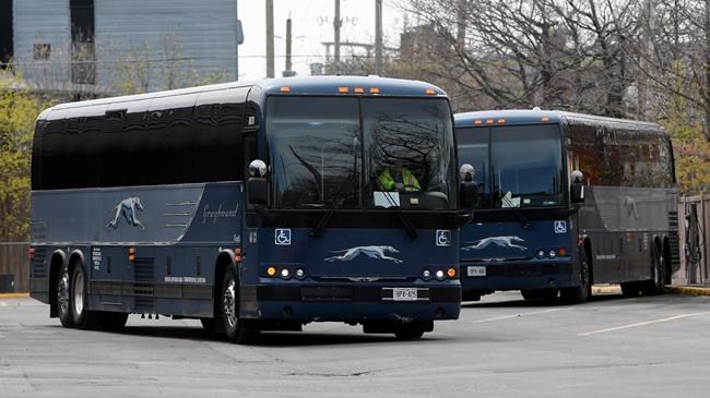 A Greyhound bus is driven out of the bus terminal in Ottawa Thursday May 7, 2020 in Ottawa. THE CANADIAN PRESS/Adrian Wyld