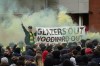 Manchester United fans let off flares and hold a banner as they protest against the Glazer family, the American owners of Manchester United, before their English Premier League soccer match against Liverpool at Old Trafford stadium in Manchester, England, Thursday, May 13, 2021. (AP Photo/Jon Super)