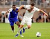 Haiti defender Jems Geffrard (6) and Canada forward Lucas Cavallini (19) pull on each other as they chase the ball during the second half of a CONCACAF Gold Cup soccer quarterfinal Saturday, June 29, 2019, in Houston. THE CANADIAN PRESS/AP/Michael Wyke