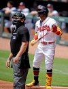 Atlanta Braves' Ronald Acuna Jr., right, watches to see if his home run hit off Toronto Blue Jays pitcher Ross Stripling stays fair in the first inning of a baseball game Thursday, May 13, 2021, in Atlanta. (AP Photo/Ben Margot)