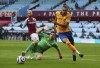 Everton's Dominic Calvert-Lewin, right, skips past Aston Villa goalkeeper Emiliano Martinez during the English Premier League soccer match between Aston Villa and Everton at Villa Park in Birmingham, England, Thursday, May 13, 2021. (AP Photo/Alex Livesey, Pool)