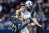Los Angeles FC's Dejan Jakovic, back, leaps to kick the ball away from Vancouver Whitecaps' Brek Shea during second half MLS soccer action in Vancouver, B.C.,&nbsp; Friday, April 13, 2018. Forge FC has signed FC announced Thursday that the club has signed veteran&nbsp; defender Dejan Jakovic. THE CANADIAN PRESS/Darryl Dyck
