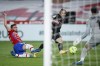 Real Madrid's Luka Modric, center, scores the opening goal during the Spanish La Liga soccer match between Granada and Real Madrid at Los Carmenes stadium in Granada, Spain, Thursday, May 13, 2021. (AP Photo/Fermin Rodriguez)