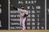 Oakland Athletics' Elvis Andrus throws to first to retire Boston Red Sox's Rafael Devers in the sixth inning of a baseball game, Thursday, May 13, 2021, in Boston. (AP Photo/Steven Senne)