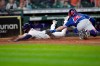 Houston Astros' Chas McCormick, left, is tagged out at home plate by Texas Rangers catcher Jose Trevino (23) during the 10th inning of a baseball game Thursday, May 13, 2021, in Houston. (AP Photo/David J. Phillip)