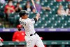 Colorado Rockies' Josh Fuentes follows through on a two-run home run off Cincinnati Reds starting pitcher Luis Castillo during the first inning of a baseball game Thursday, May 13, 2021, in Denver. (AP Photo/David Zalubowski)