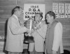 FILE - Ben Hogan gets the PGA Championship trophy from PGA president Ed Dudley, left, after winning the golf tournament in Portland, Oregon, in this Aug. 25, 1946, file photo. Hogan beat Ed Oliver, right, 6 and 4. It was 75 years ago when Ben Hogan won the first of his nine majors at the 1946 PGA Championship.(AP Photo/Paul Wagner, File)