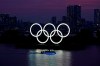 The Olympic rings float in the water at sunset in the Odaiba section of Tokyo, Wednesday, June 3, 2020. A new Leger poll suggests Canadians are divided over plans to send athletes from Canada to the upcoming Olympic games in Tokyo as Japan grapples with climbing COVID-19 cases. THE CANADIAN PRESS/AP, Eugene Hoshiko
