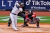 New York Yankees' Aaron Hicks hits an RBI-single during the third inning of a baseball game against the Washington Nationals at Yankee Stadium, Sunday, May 9, 2021, in New York. (AP Photo/Seth Wenig)