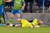 Seattle Sounders goalkeeper Stefan Frei (24) grimaces after colliding with a San Jose Earthquakes player during the second half of an MLS soccer match Wednesday, May 12, 2021, in San Jose, Calif. The Sounders won 1-0. (AP Photo/Tony Avelar)