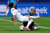 Austin FC forward Cecilio Dominguez, left, is tripped by Los Angeles Galaxy defender Julian Araujo during the first half of a Major League Soccer match Saturday, May 15, 2021, in Carson, Calif. (AP Photo/Mark J. Terrill)