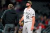 Colorado Rockies relief pitcher Ben Bowden waits to be pulled from the mound after he issued a walk to Cincinnati Reds' Jonathan India during the 11th inning of a baseball game Saturday, May 15, 2021, in Denver. (AP Photo/David Zalubowski)