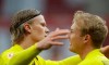 Dortmund's Erling Haaland, left, celebrates his sides third goal scored by Dortmund's Julian Brandt, right, during the German Bundesliga soccer match between FSV Mainz 05 and Borussia Dortmund in Mainz, Germany, Sunday, May 16, 2021. (AP Photo/Michael Probst,Pool)