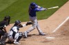 Chicago Cubs' Ian Happ hits a solo home run against the Detroit Tigers in the sixth inning of a baseball game in Detroit, Sunday, May 16, 2021. (AP Photo/Paul Sancya)