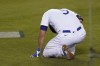 Los Angeles Dodgers' Corey Seager (5) reacts after being hit by a pitch from Miami Marlins relief pitcher Ross Detwiler during the fifth inning a baseball game Saturday, May 15, 2021, in Los Angeles. (AP Photo/Ashley Landis)
