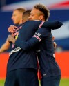 PSG's Neymar, right, celebrates with PSG's Kylian Mbappe after he scores his sides first goal during the French League One soccer match between Paris Saint-Germain and Reims at the Parc des Princes stadium in Paris, France, Sunday, May 16, 2021. (AP Photo/Michel Euler)