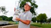 Kyoung-Hoon Lee, of South Korea, holds the trophy on the 18th green after winning the AT&T Byron Nelson golf tournament in McKinney, Texas, Sunday, May 16, 2021. (AP Photo/Ray Carlin)