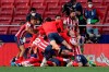 Atletico Madrid players celebrate after teammate Luis Suarez scored their side's second goal during the Spanish La Liga soccer match between Atletico Madrid and Osasuna at the Wanda Metropolitano stadium in Madrid, Spain, Sunday, May 16, 2021. (AP Photo/Manu Fernandez)