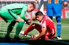 Barcelona's goalkeeper Marc-Andre ter Stegen, left, helps Atletico Madrid's Luis Suarez during the Spanish La Liga soccer match between FC Barcelona and Atletico Madrid at the Camp Nou stadium in Barcelona, Spain, Saturday, May 8, 2021. (AP Photo/Joan Monfort)