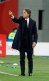 FILE -- In this Oct. 14, 2018 file photo Italy coach Roberto Mancini gestures during the UEFA Nations League soccer match between Poland and Italy at the Silesian Stadium Chorzow, Poland, Sunday . Italy coach Roberto Mancini had his contract extended through 2026 on Monday, May 17, 2021, allowing him to stay in charge of the Azzurri for the next two World Cups. (AP Photo/Czarek Sokolowski)