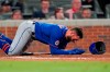 New York Mets' Kevin Pillar (11) tries to get to his feet after being hit in the face with a pitch from Atlanta Braves pitcher Jacob Webb in the seventh inning of a baseball game Monday, May 17, 2021, in Atlanta. (AP Photo/John Bazemore)