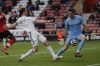Leeds United's Patrick Bamford, center, scores the opening goal during the English Premier League soccer match between Southampton and Leeds United at St. Mary's Stadium in Southampton, England, Tuesday, May 18, 2021.(AP Photo/Frank Augstein, Pool)