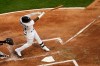 Chicago White Sox's Yermin Mercedes follows through on an RBI single off Minnesota Twins starting pitcher J.A. Happ during the first inning of a baseball game Wednesday, May 12, 2021, in Chicago. (AP Photo/Charles Rex Arbogast)