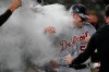 Detroit Tigers starting pitcher Spencer Turnbull (56) is showered with beer and powder by teammates after Turnbull threw a no-hitter in the team's baseball game against the Seattle Mariners, Tuesday, May 18, 2021, in Seattle. The Tigers won 5-0. (AP Photo/Ted S. Warren)