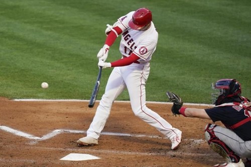 Los Angeles Angels designated hitter Shohei Ohtani (17) hits a home run during the first inning of a baseball game against the Cleveland Indians Tuesday, May 18, 2021, in Anaheim, Calif. (AP Photo/Ashley Landis)