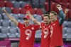 Bayern's Robert Lewandowski, left, Bayern's Thomas Mueller, centre, and Bayern's goalkeeper Manuel Neuer celebrate at the end of the German Bundesliga soccer match between Bayern Munich and Borussia Moenchengladbach at the Allianz Arena stadium in Munich, Germany, Saturday, May 8, 2021.(Peter Kneffel/Pool via AP)