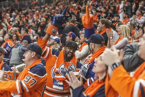 Edmonton Oilers fans celebrate a goal during first period NHL action against the Vancouver Canucks, in Edmonton, Wednesday, Oct. 2, 2019. Alberta's premier is not ready to follow Quebec's lead in allowing hockey fans to attend NHL playoff games. THE CANADIAN PRESS/Jason Franson