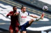 Tottenham's Gareth Bale, right, and Wolverhampton Wanderers' Nelson Semedo challenge for the ball during the English Premier League soccer match between Tottenham Hotspur and Wolverhampton Wanderers at Tottenham Hotspur Stadium in London, England, Sunday, May 16, 2021. (AP Photo/Adrian Dennis, Pool)