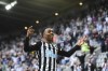Newcastle's Joe Willock celebrates after scoring the opening goal during the English Premier League soccer match between Newcastle United and Sheffield United at St. James' Park in Newcastle, England, Wednesday, May 19, 2021. (Stu Forster/Pool via AP)