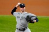 New York Yankees starting pitcher Corey Kluber throws to a Texas Rangers batter during the fifth inning of a baseball game in Arlington, Texas, Wednesday, May 19, 2021. (AP Photo/Tony Gutierrez)