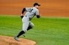 New York Yankees starting pitcher Corey Kluber sprints to help cover the bag on groundout to first by Texas Rangers' Joey Gallo during the eighth inning of a baseball game in Arlington, Texas, Wednesday, May 19, 2021. (AP Photo/Tony Gutierrez)