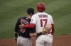 Los Angeles Angels' Shohei Ohtani, right, of Japan, is greeted by Cleveland Indians first baseman Jake Bauers after hitting a single on a bunt during the sixth inning of a baseball game, Wednesday, May 19, 2021, in Anaheim, Calif. (AP Photo/Jae C. Hong)