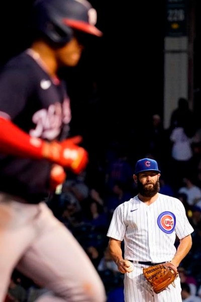 Chicago Cubs starting pitcher Jake Arrieta, right, reacts as Washington Nationals' Juan Soto rounds the bases after hitting a solo home run during the fifth inning of a baseball game in Chicago, Wednesday, May 19, 2021. (AP Photo/Nam Y. Huh)